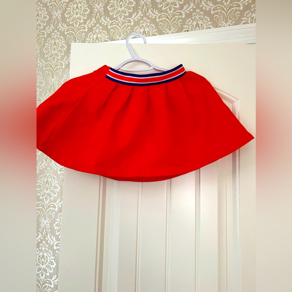 Orange skirt, size 6, excellent condition.
